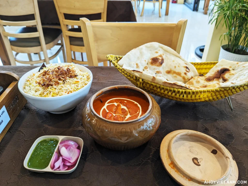 Rice, butter chicken, and naan at Lazeez